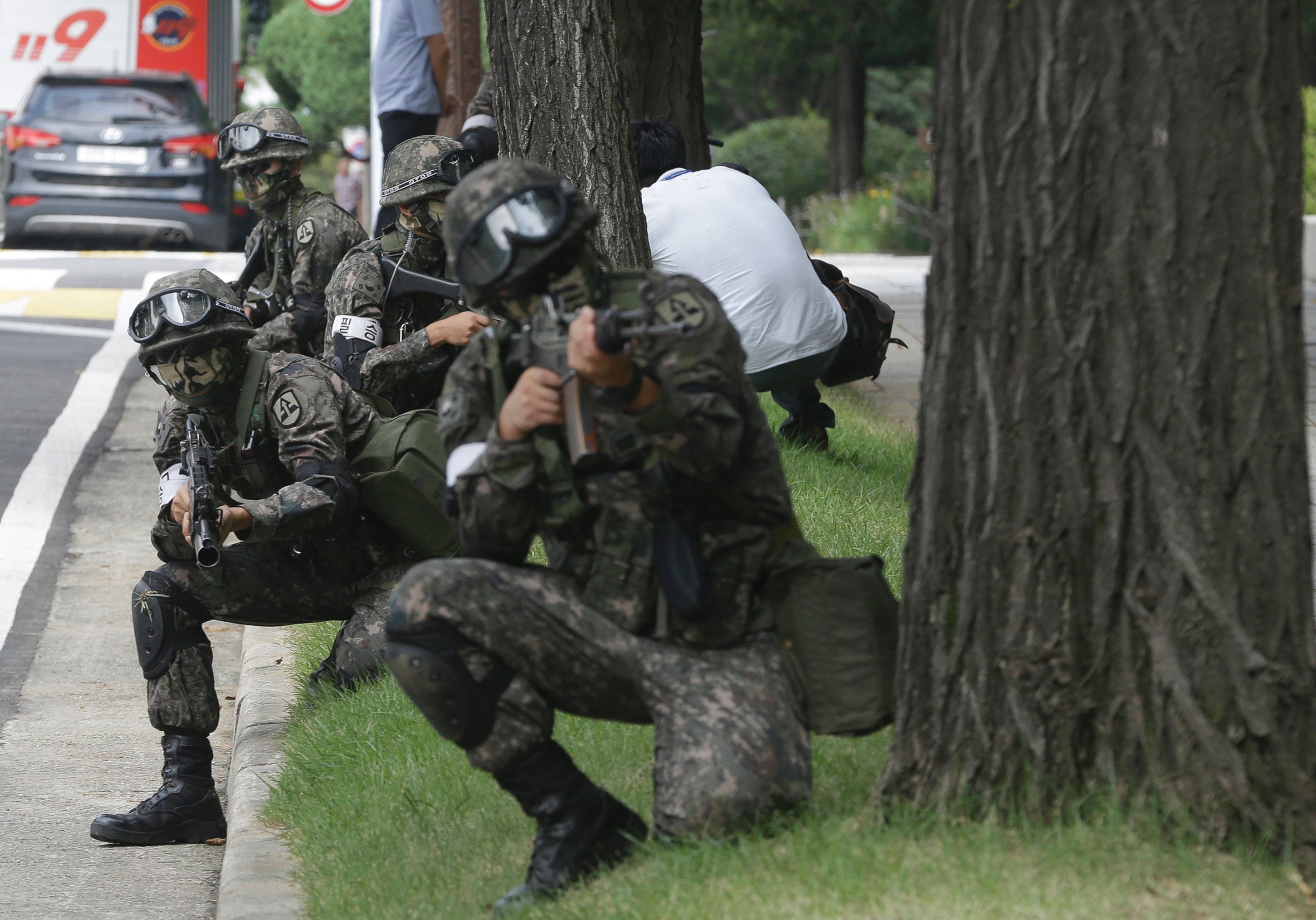 In this Aug. 24, 2016 file photo, South Korean army soldiers conduct an anti-terror drill as part of Ulchi Freedom Guardian exercise, at the National Assembly in Seoul, South Korea. 