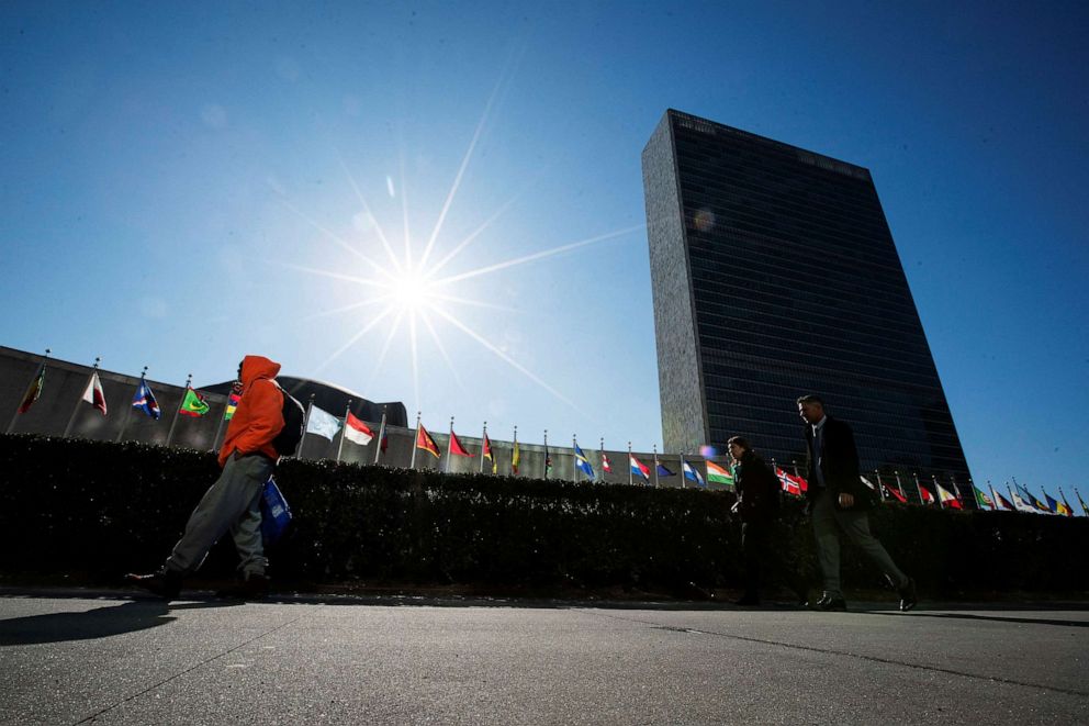 PHOTO: People walk in front of United Nations Headquarters in New York, March 29, 2023.