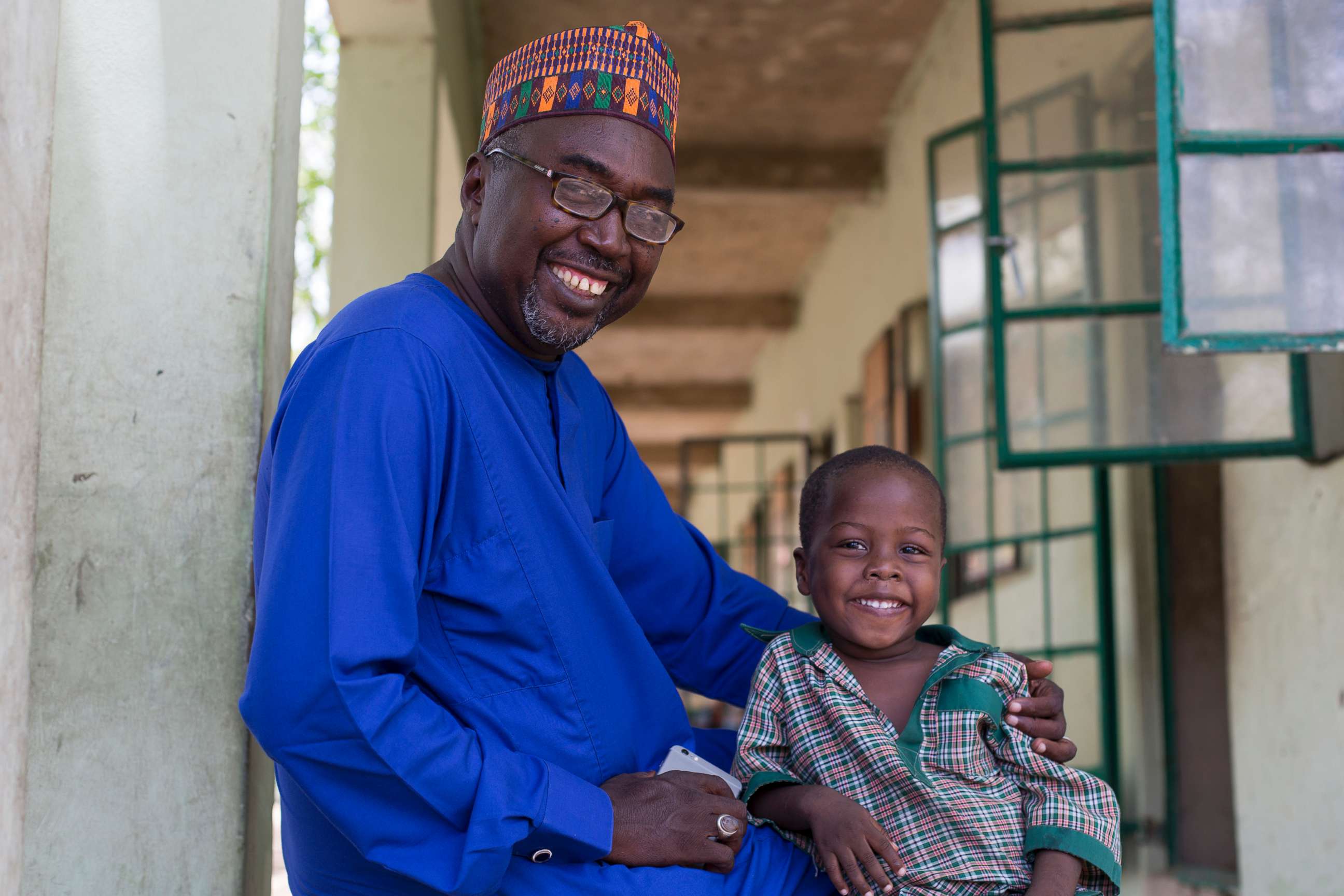PHOTO: Zannah Mustapha and his son who is enrolled in a nursery class at the Future Prowess Islamic Foundation School in Maiduguri, Borno State, Nigeria, May 17, 2017.