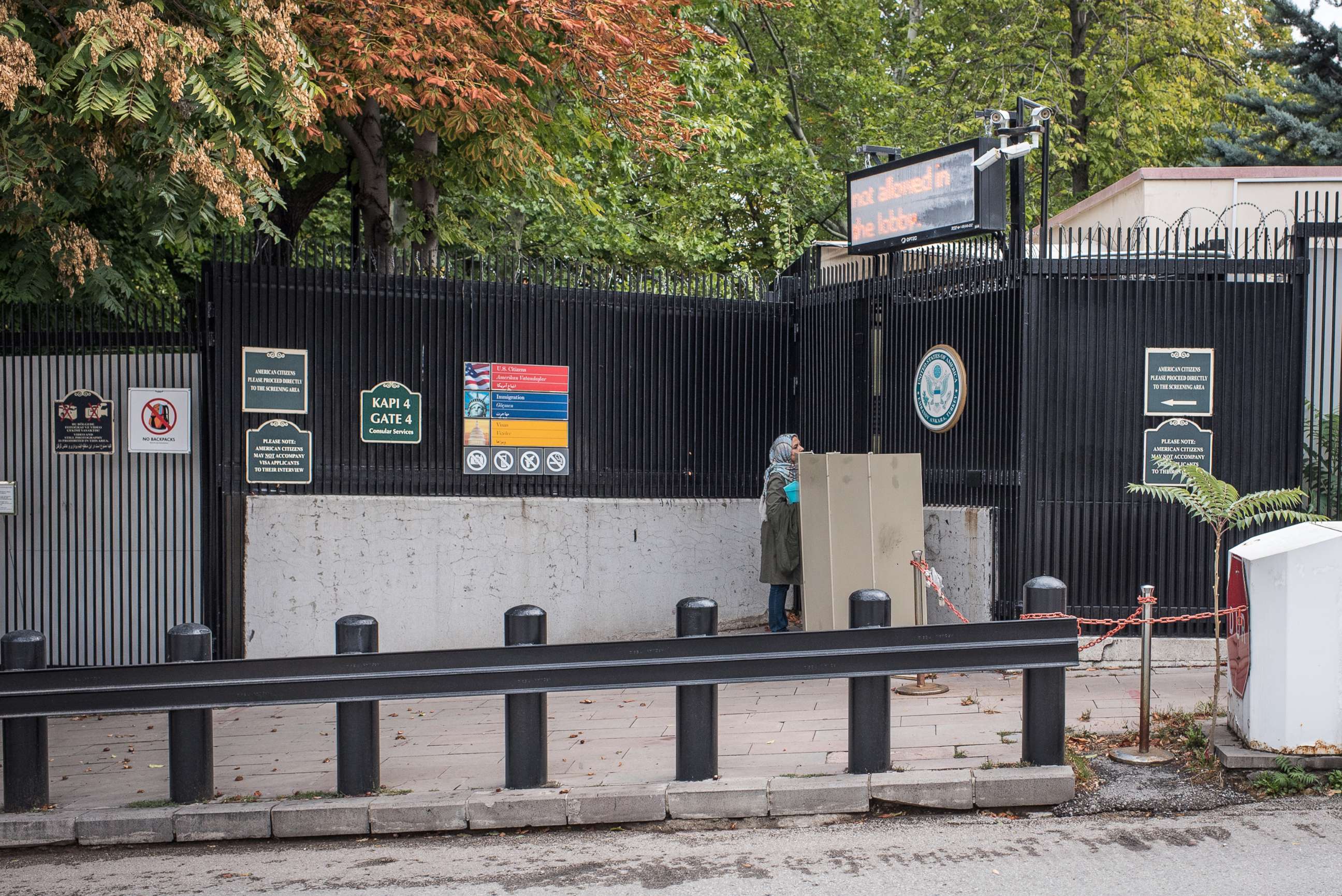 PHOTO: A woman stands at the closed entrance of the United States Embassy in Ankara, Turkey, Oct. 9, 2017. American visa services were halted at US missions in Turkey following the detention of US consulate personnel in Istanbul.