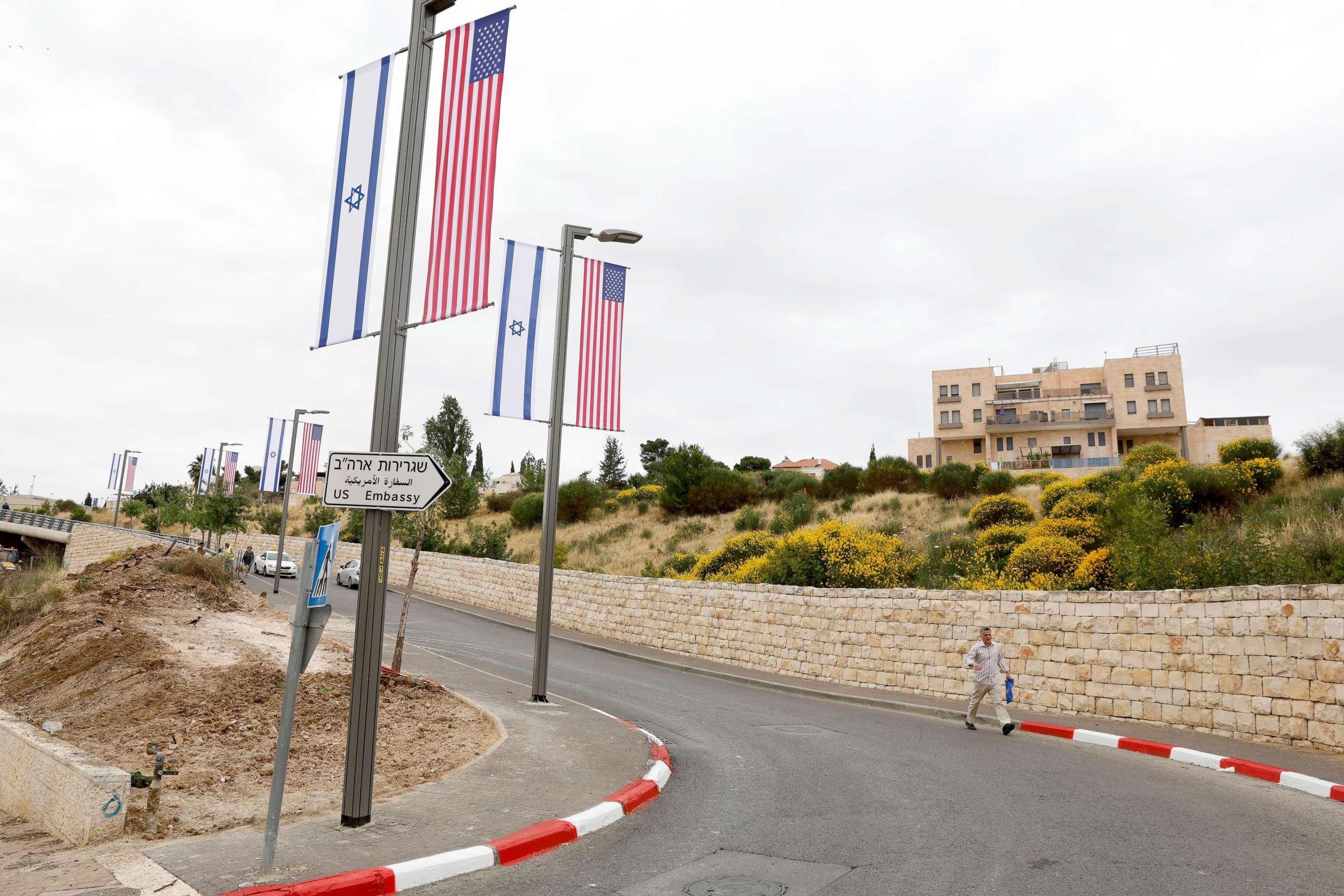 PHOTO: A new road sign and flags are placed at the road leading to the U.S. consulate in the Jewish neighborhood of Arnona on the East-West Jerusalem line in Jerusalem, May 8, 2018.