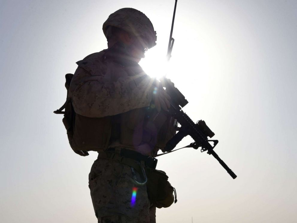 PHOTO: A U.S. soldier watches Afghan commandos take part in a combat training exercise at Shorab Military Camp in Lashkar Gah in Helmand province, Afghanistan, Aug. 27, 2017.