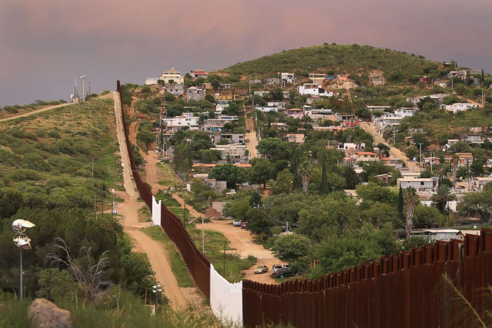 PHOTO: The U.S.-Mexico border fence is seen at sunset, July 22, 2018, in Nogales, Ariz.