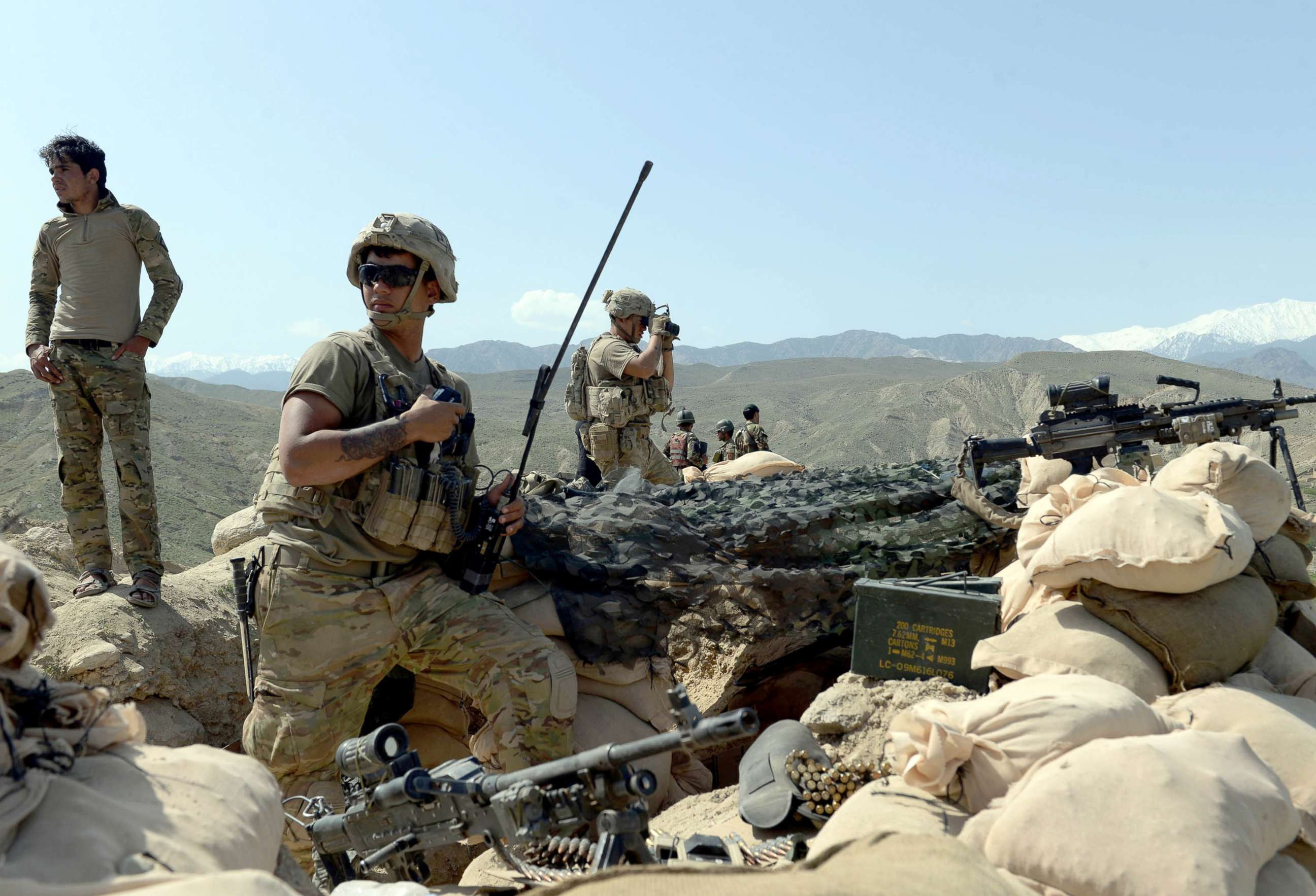 PHOTO: In this photograph taken on April 11, 2017, US soldiers take up positions during an ongoing an operation against Islamic State (IS) militants in the Achin district of Afghanistan's Nangarhar province.