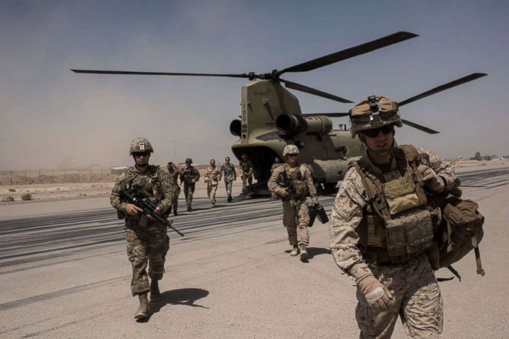PHOTO: U.S. service members walk off a helicopter on the runway at Camp Bost on Sept. 11, 2017 in Helmand Province, Afghanistan.