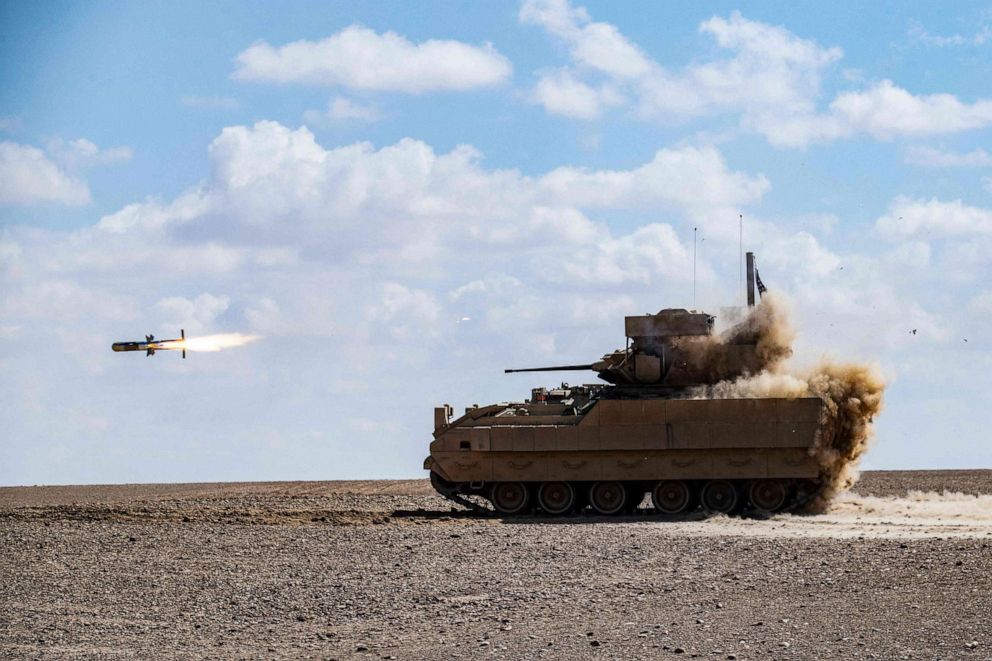 FILE PHOTO: In this file photo taken on March 25, 2022, a U.S. Bradley Fighting Vehicle (BFV) fires an AGM-114 Hellfire during a heavy-weaponry military exercise in the countryside of Deir ez-Zor province in eastern Syria.