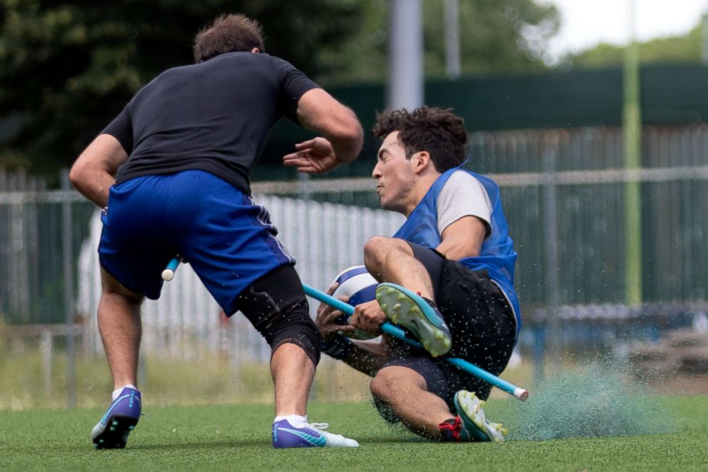 PHOTO: US Quidditch players Harry Greenhouse, left, and Martin Bermudez Jr., practice in Florence, Italy, June 26, 2018.