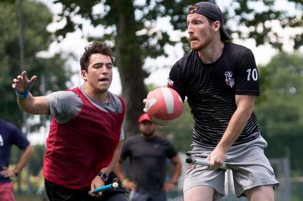 PHOTO: US Quidditch player Martin Bermudez Jr, left, pursues player Luke Langlinais, who is holding a "quaffle" during practice in Florence, Italy, June 26, 2018.