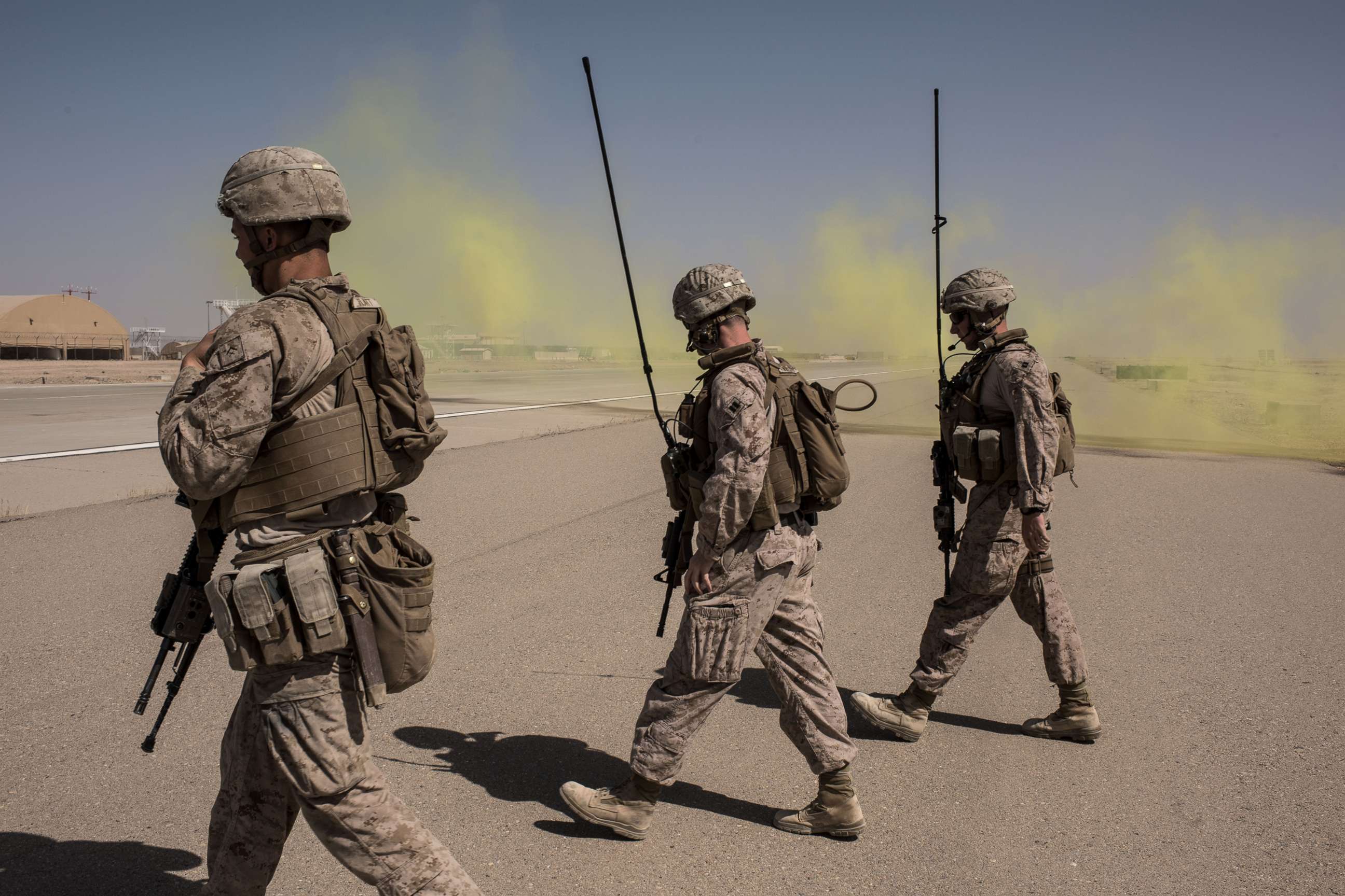 PHOTO: Members of the U.S. Marine Corp Task Force South West walk across a runway after marking a location for an airdrop of cargo on Sept. 10, 2017 at Camp Shorab in Helmand Province, Afghanistan.