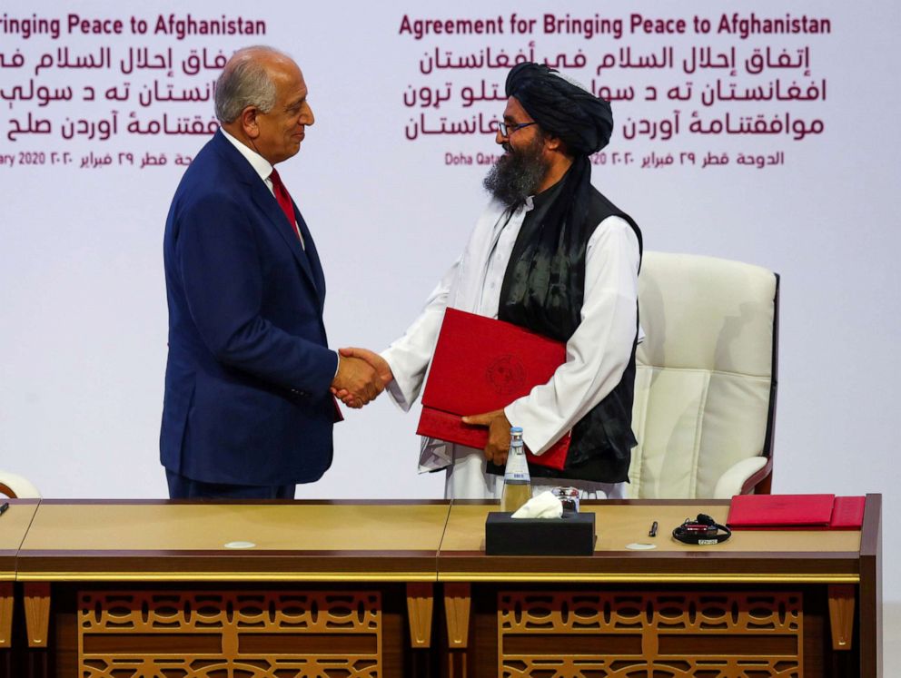 PHOTO: Mullah Abdul Ghani Baradar, the leader of the Taliban delegation, and Zalmay Khalilzad, U.S. envoy for peace in Afghanistan, shake hands after signing an agreement at a ceremony in Doha, Qatar, Feb. 29, 2020.