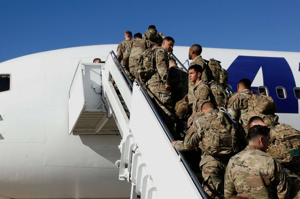 PHOTO: U.S. Army paratroopers assigned to 1st Brigade Combat Team, 82nd Airborne Division board an aircraft bound for the U.S. Central Command area of operations from Fort Bragg, North Carolina, Jan. 5, 2020.