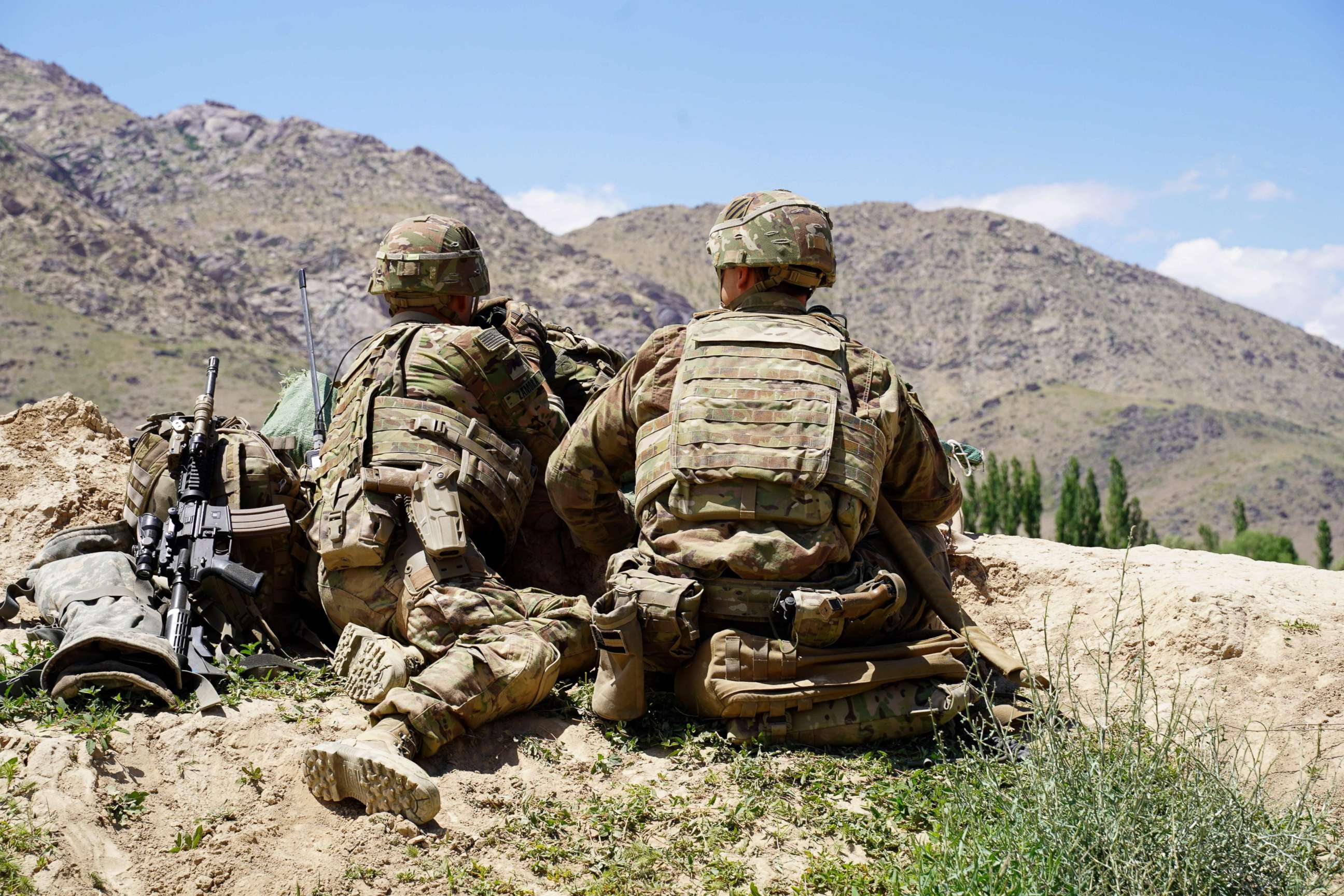 PHOTO: In this photo taken on June 6, 2019, US soldiers look out over hillsides during a visit of the commander of US and NATO forces in Afghanistan General Scott Miller at the Afghan National Army (ANA) checkpoint in Nerkh district of Wardak province.