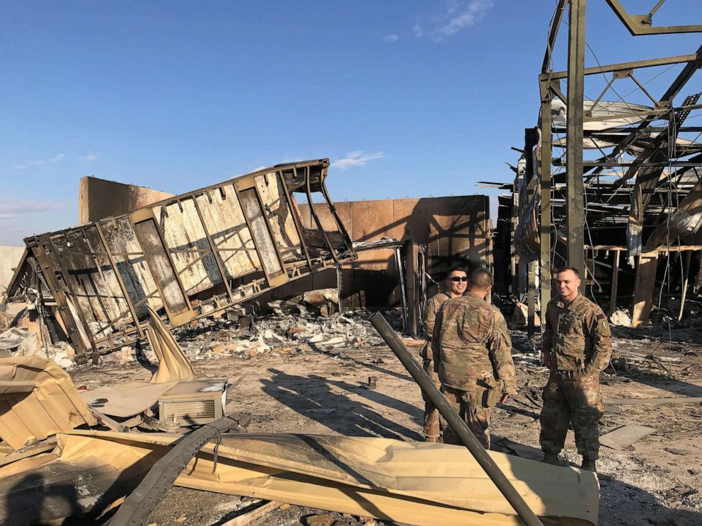 PHOTO: U.S. soldiers stand at the site where an Iranian missile hit at Ain al-Asad air base in Anbar province, Iraq, Jan. 13, 2020. 