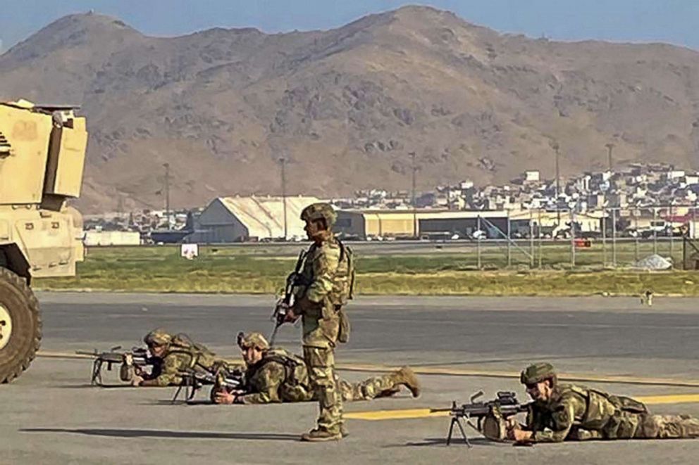 PHOTO: US soldiers take up their positions as they secure the airport in Kabul on Aug. 16, 2021, after a stunningly swift end to Afghanistan's 20-year war, as thousands mobbed the city's airport trying to flee the group's hardline brand of Islamist rule.