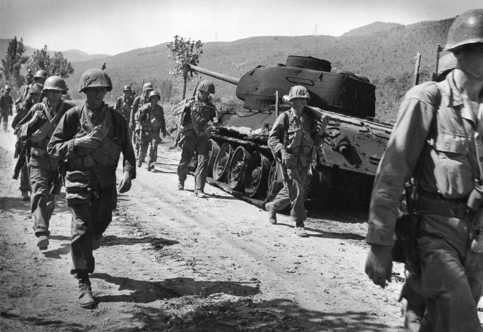 PHOTO: American troops walking down a road in Korea, Sept. 16, 1950.