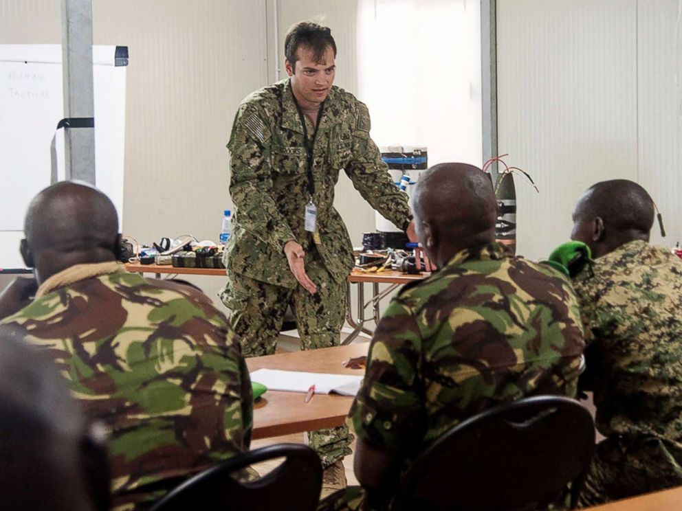 PHOTO: U.S. Navy Explosive Ordnance Disposal 1st Class Tyler Brooks, Task Force Sparta, teaches how to identify and counter improvised explosive devices to participants at the Joint Military Training Center in Mogadishu, Somalia, Aug. 25, 2016.