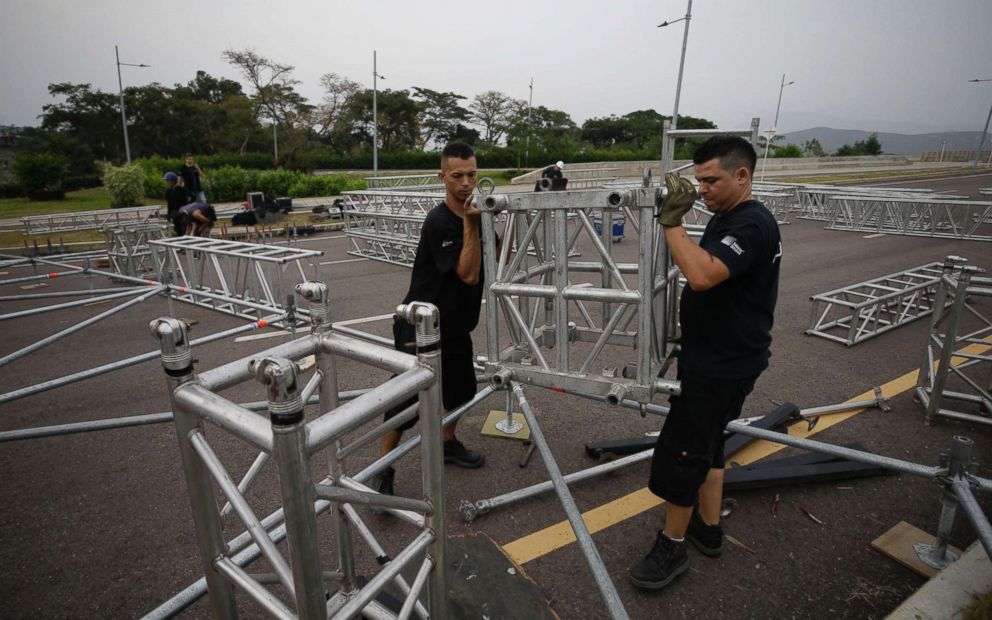 PHOTO: Workers prepare the area for the upcoming "Venezuela Aid Live" concert at the Tienditas International Bridge on the outskirts of Cucuta, Colombia, on the border with Venezuela, Feb. 20, 2019.