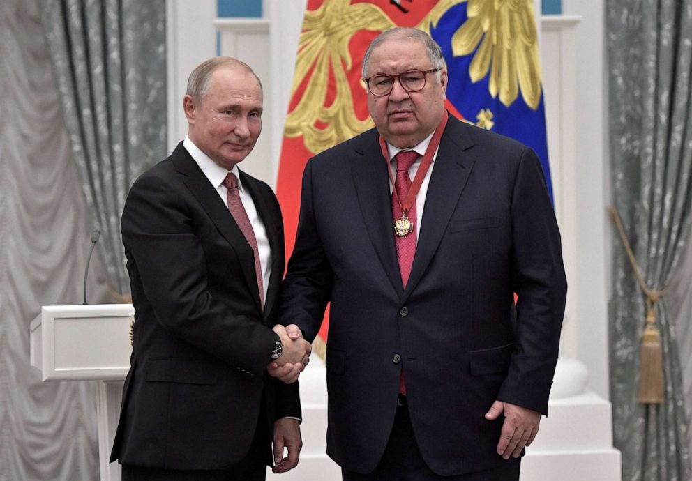 PHOTO: Russian President Vladimir Putin shakes hands with Russian businessman Alisher Usmanov during an awards ceremony at the Kremlin in Moscow, Russia, November 27, 2018.