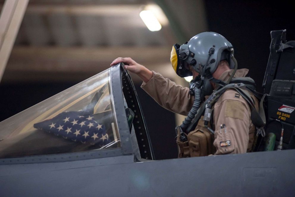 PHOTO: A pilot works in the cockpit at a U.S. military site. 