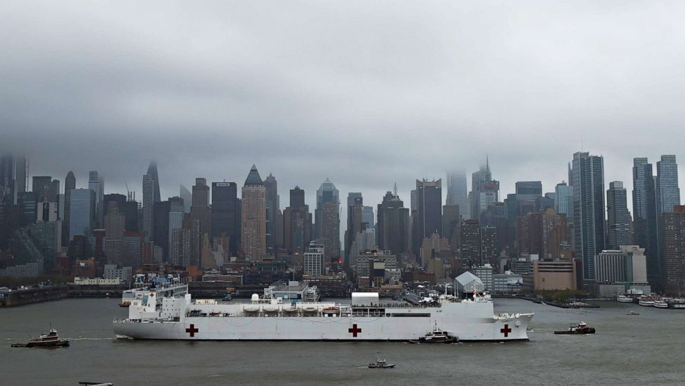 PHOTO: The U.S. Navy hospital ship USNS Comfort departs Pier 90 in Manhattan under thick fog to return to its home port of Norfolk, Va., after treating patients during the outbreak of the coronavirus (COVID-19) in New York City, April 30, 2020.