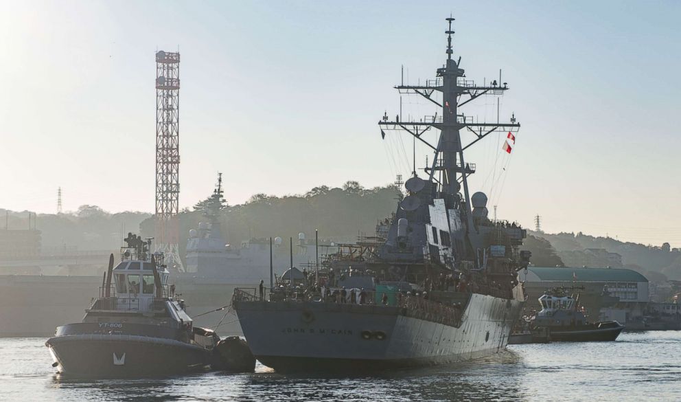 PHOTO: The guided missile destroyer USS John S. McCain is pulled towards a pier after departing from a dry dock at Fleet Activities Yokosuka in Japan, Nov. 27, 2018.