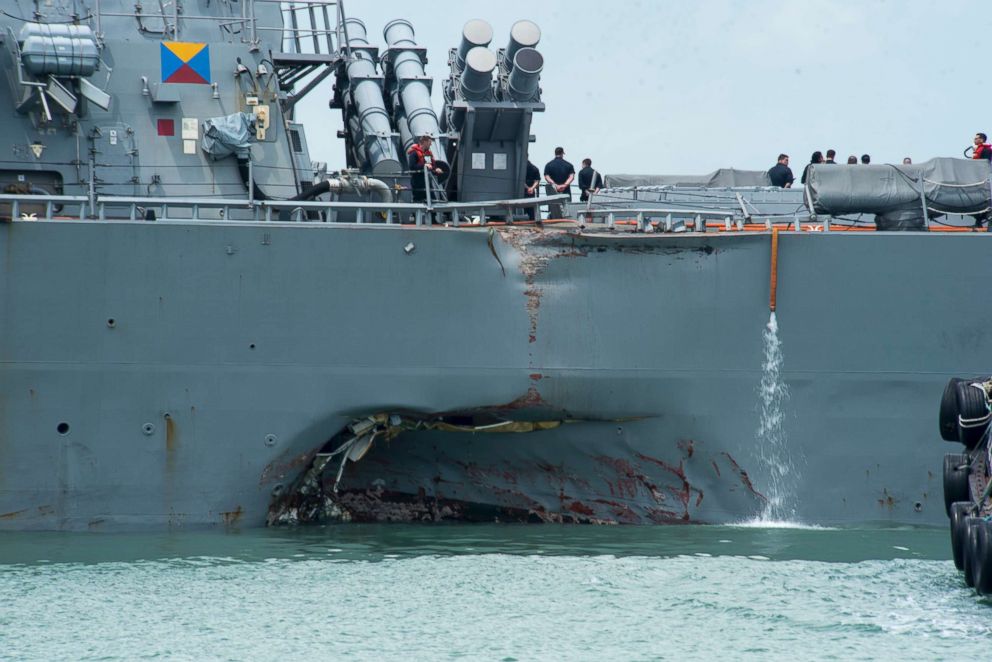 PHOTO: Damage to the port side is visible on the Guided-missile destroyer USS John S. McCain following a collision with the merchant vessel Alnic MC while underway east of the Straits of Malacca and Singapore on Aug. 21, 2017.