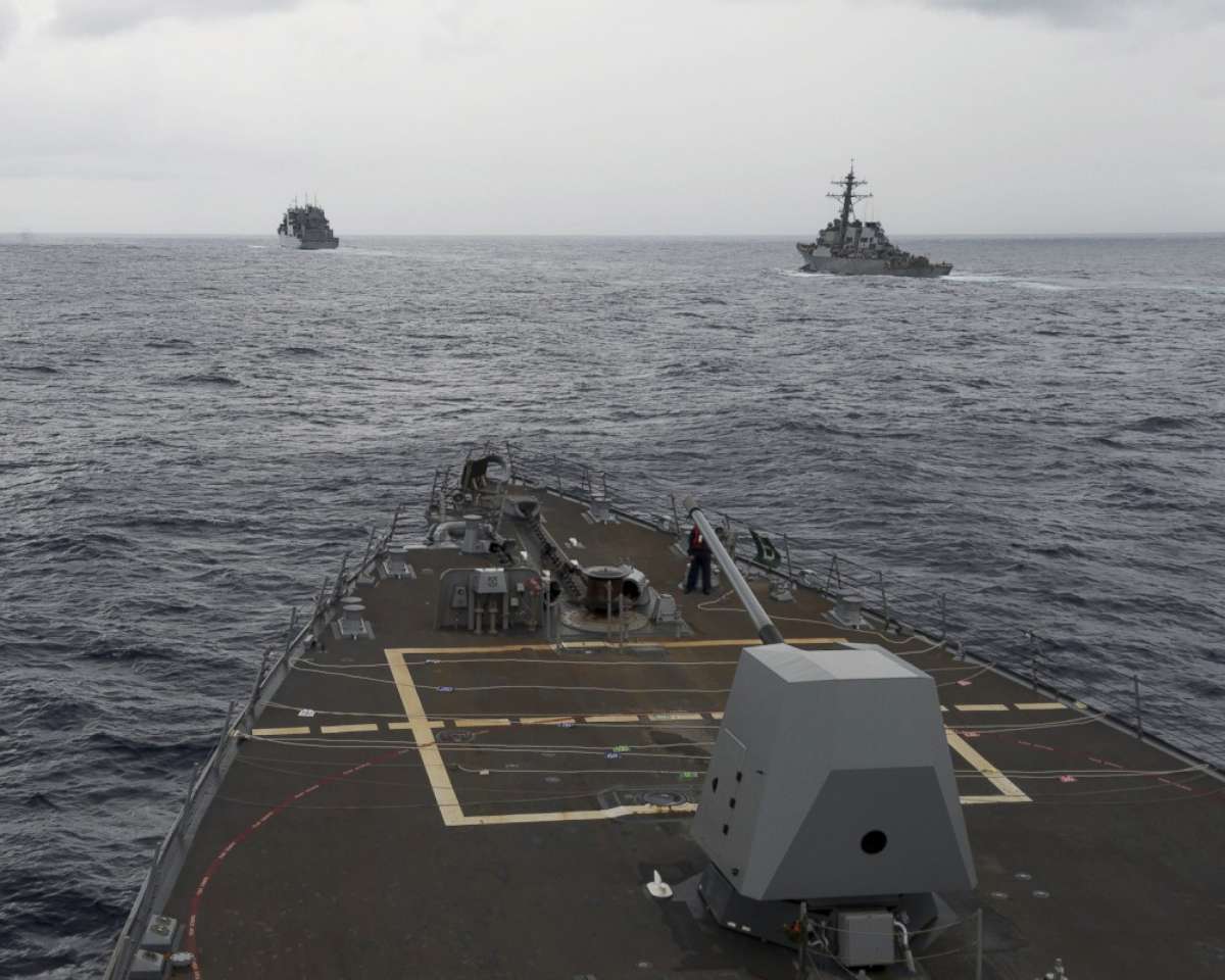 PHOTO: This image provided by the U.S. Navy, taken Oct. 17, 2016, shows the guided missile destroyer USS Decatur, right, pulling into position behind the Military Sealift Command USNS Matthew Perry, seen from the the USS Spruance, in the South China Sea.