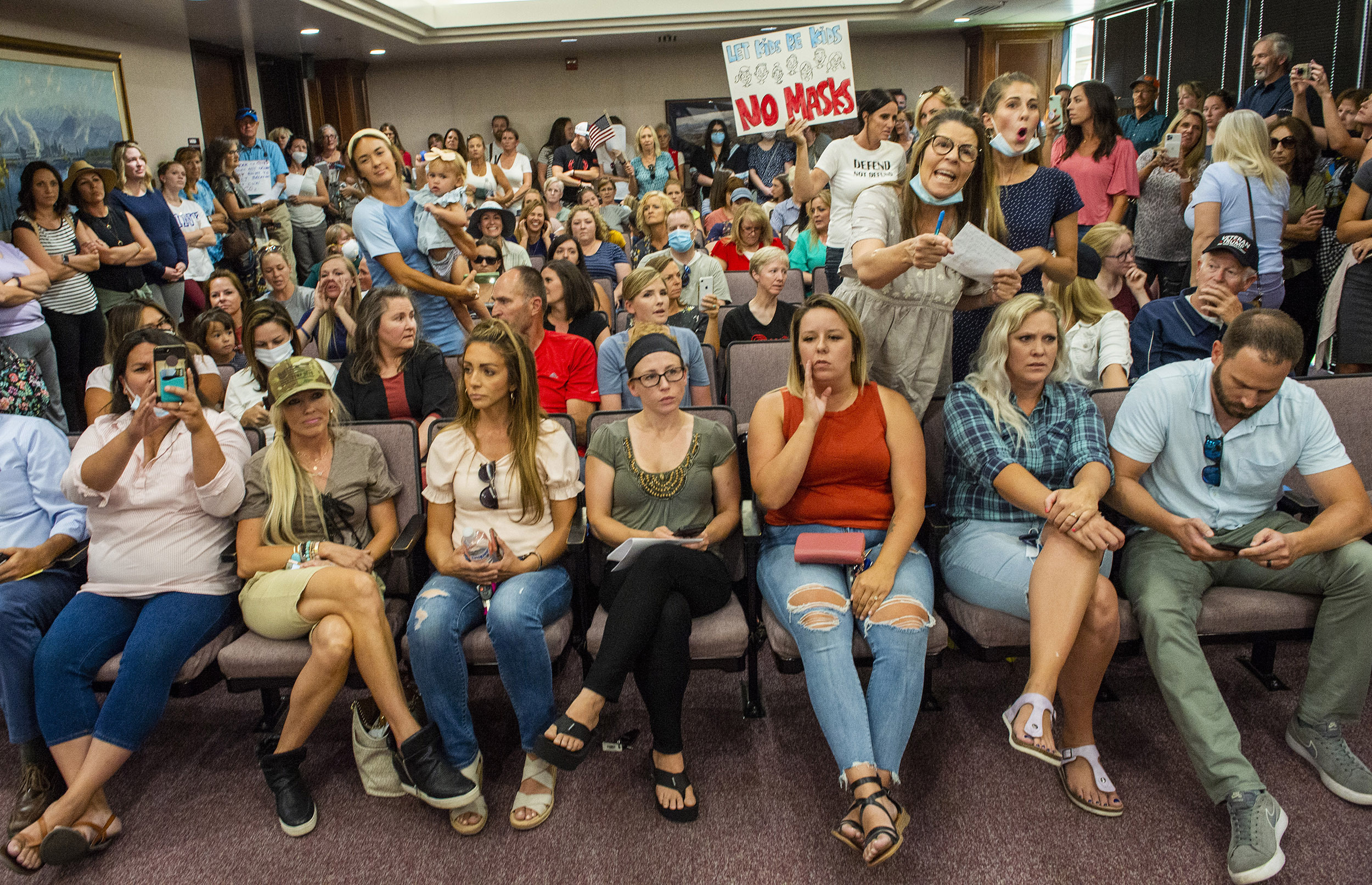 PHOTO: Angry residents react when the Utah County Commission meeting was adjourned before it even started, July 15, 2020, in Provo, Utah.