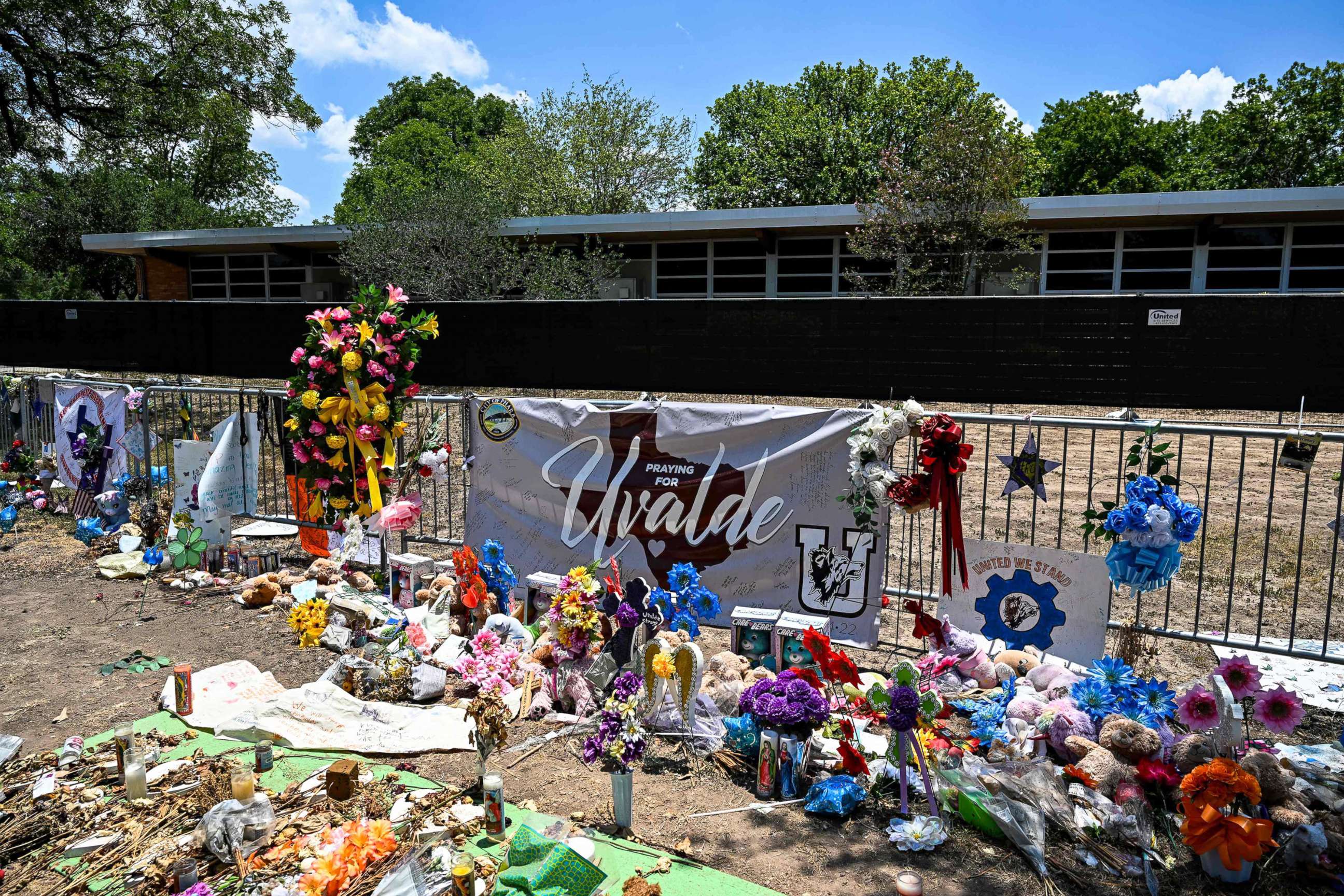 PHOTO: Mementos decorate a makeshift memorial to the victims of a shooting at Robb Elementary School in Uvalde, Texas, on June 30, 2022.