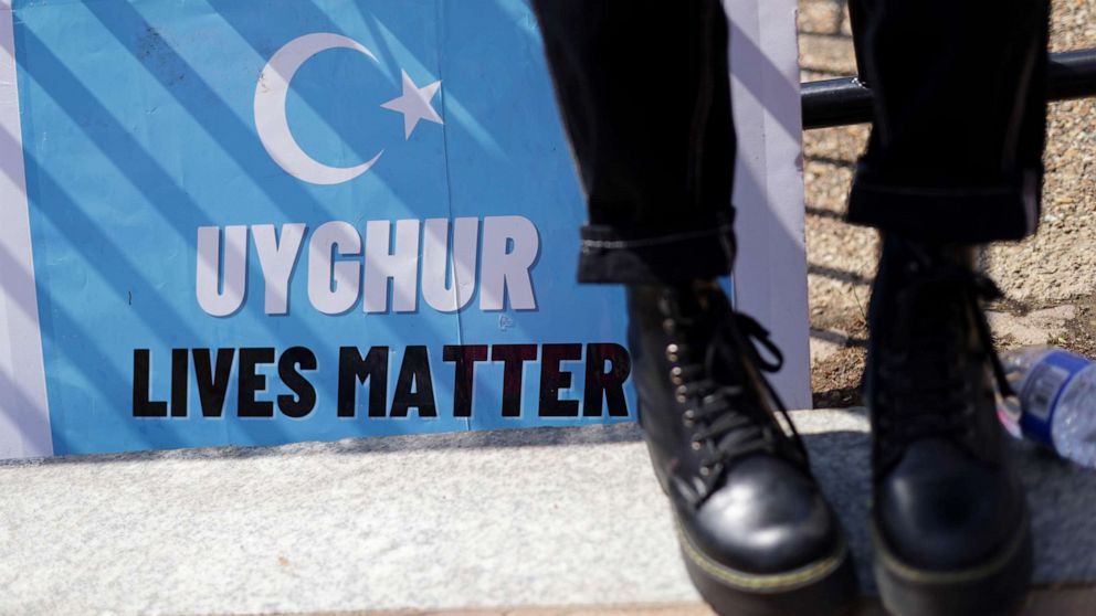 PHOTO: A sign that reads "Uyghur Lives Matter" is seen during a demonstration against the 2022 Olympics in China, at Lafayette Square, May 27, 2021, in Washington, D.C.