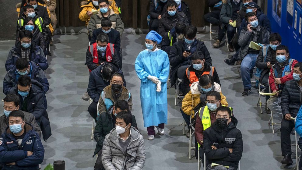 PHOTO: Chinese workers, including security guards, wait to receive a COVID-19 vaccine jab at a mass vaccination center for Chaoyang District on Jan. 15, 2021, in Beijing.