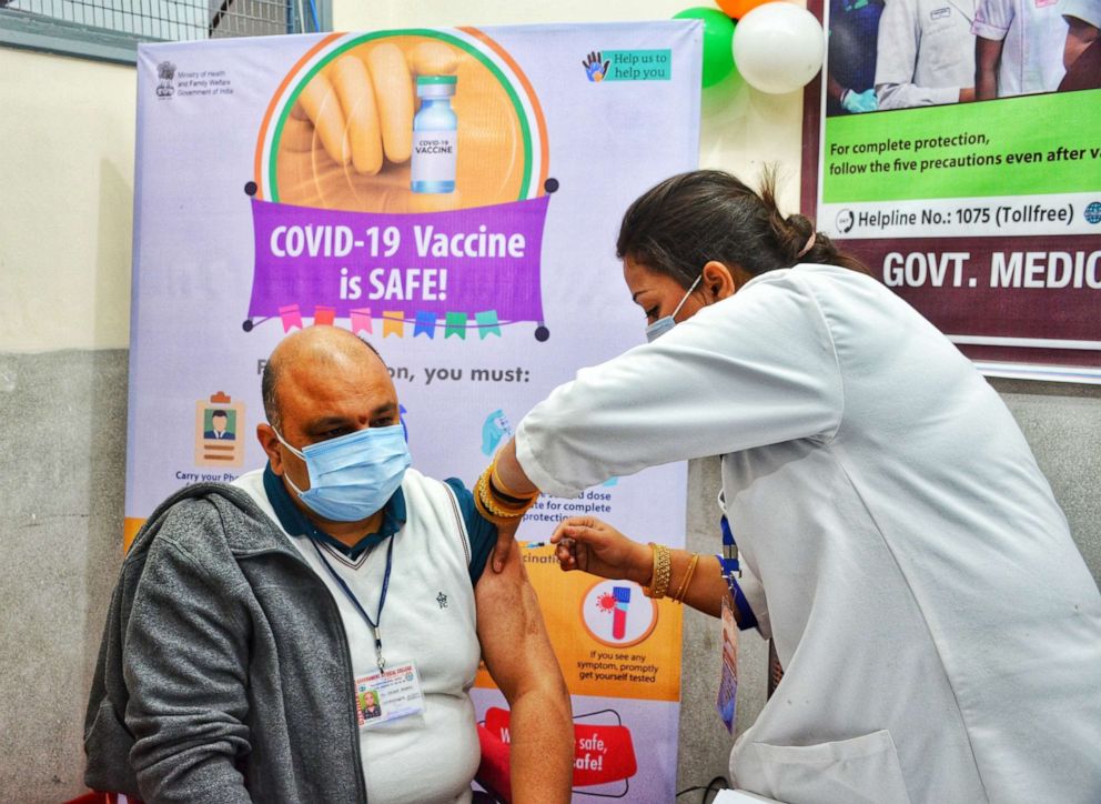 PHOTO: A health worker receives a COVID-19 vaccine at a hospital in Jammu, India, Jan. 16, 2021.