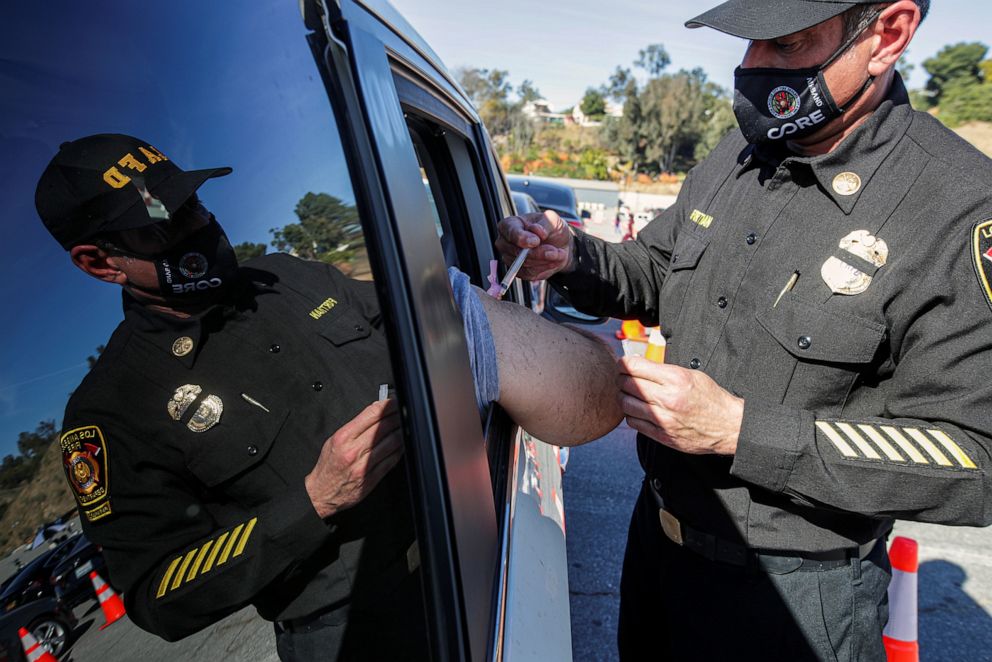 PHOTO: Los Angeles Fire Assistant Fire Chief Ellsworth Fortman administers as COVID-19 vaccine as mass-vaccination of healthcare workers starts at Dodger Stadium in Los Angeles, Jan. 15, 2021.