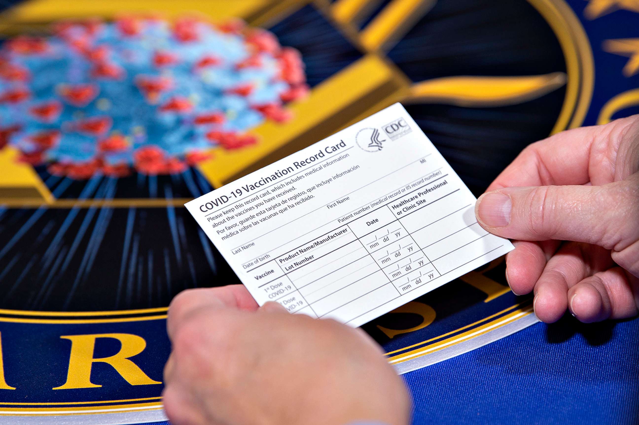 PHOTO: A Department of Health and Human Services employee holds a COVID-19 vaccine record card Nov. 13, 2020, in Washington D.C.