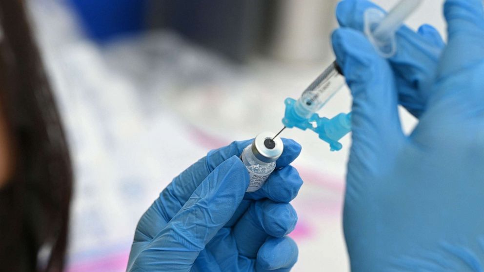 PHOTO: A healthcare worker fills a syringe with Pfizer COVID-19 vaccine at a community vaccination event in Los Angeles, Aug. 11, 2021.