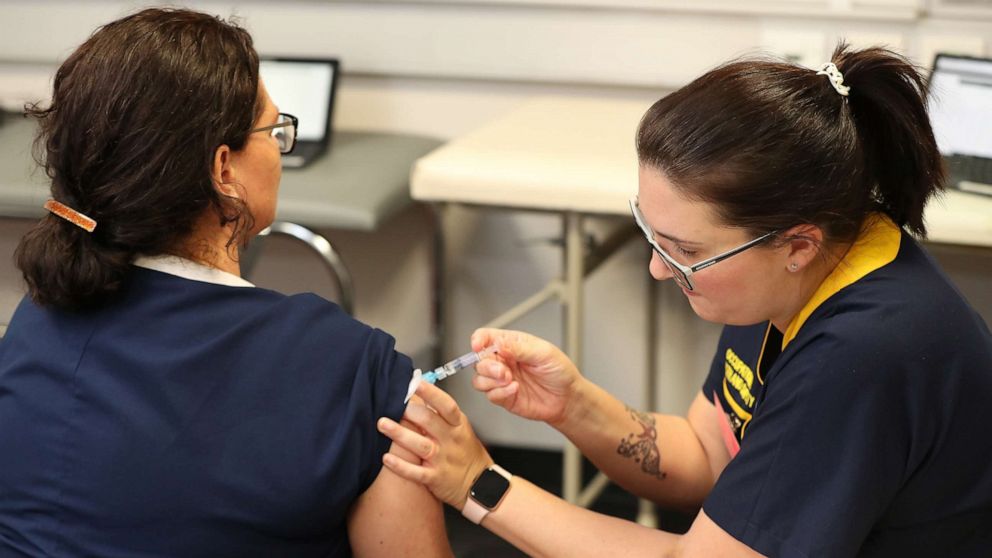 PHOTO: PERTH, AUSTRALIA - APRIL 20: Registered nurse Heather Hoppe receives a flu vaccination in the trial clinic at Sir Charles Gairdner hospital on April 20, 2020 in Perth, Australia.
