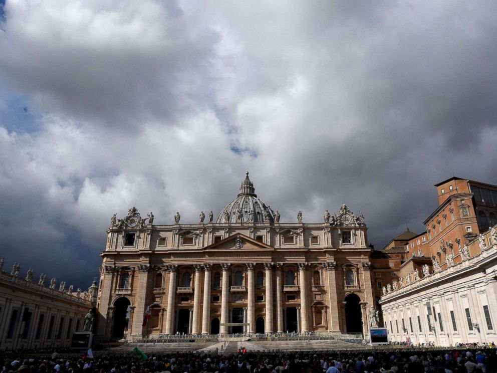 PHOTO: People gather in St. Peters Square as Pope Francis recites the Angelus noon prayer from the window of his studio at the Vatican, Oct. 7, 2018.