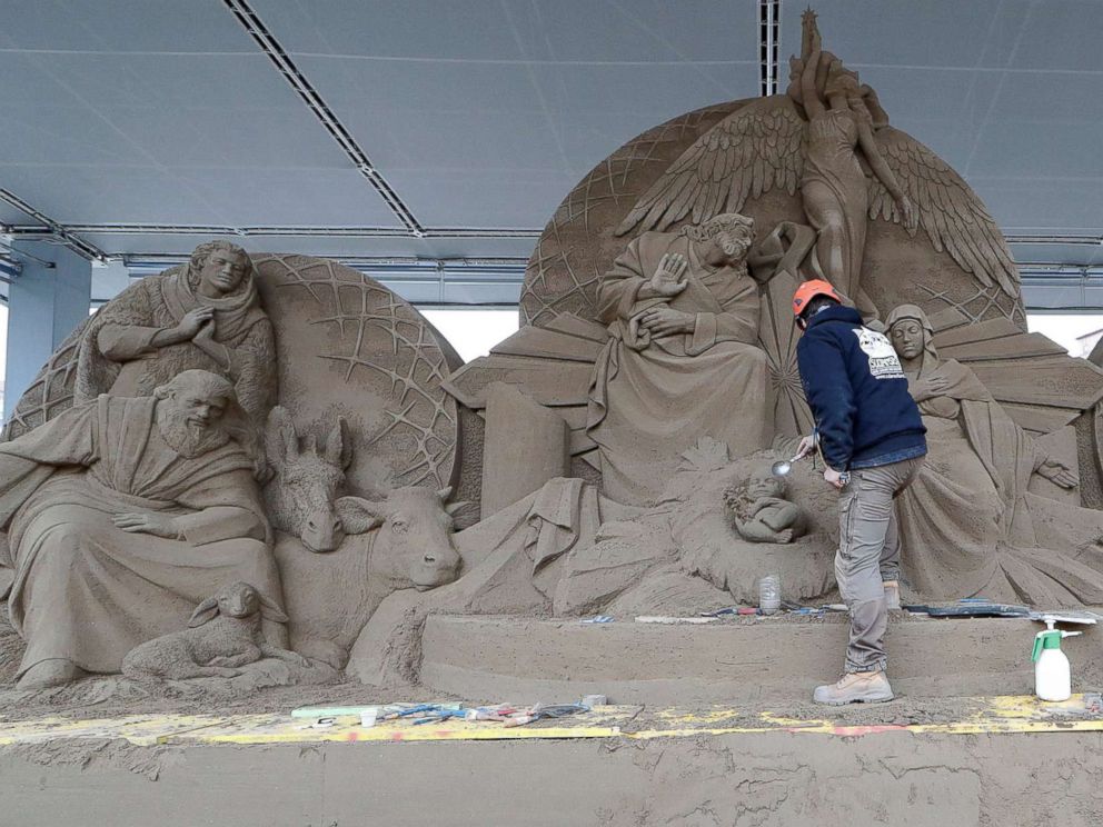 PHOTO: An artist works on a sand sculpture representing part of nativity scene in St. Peters square at the Vatican, Dec. 6, 2018.