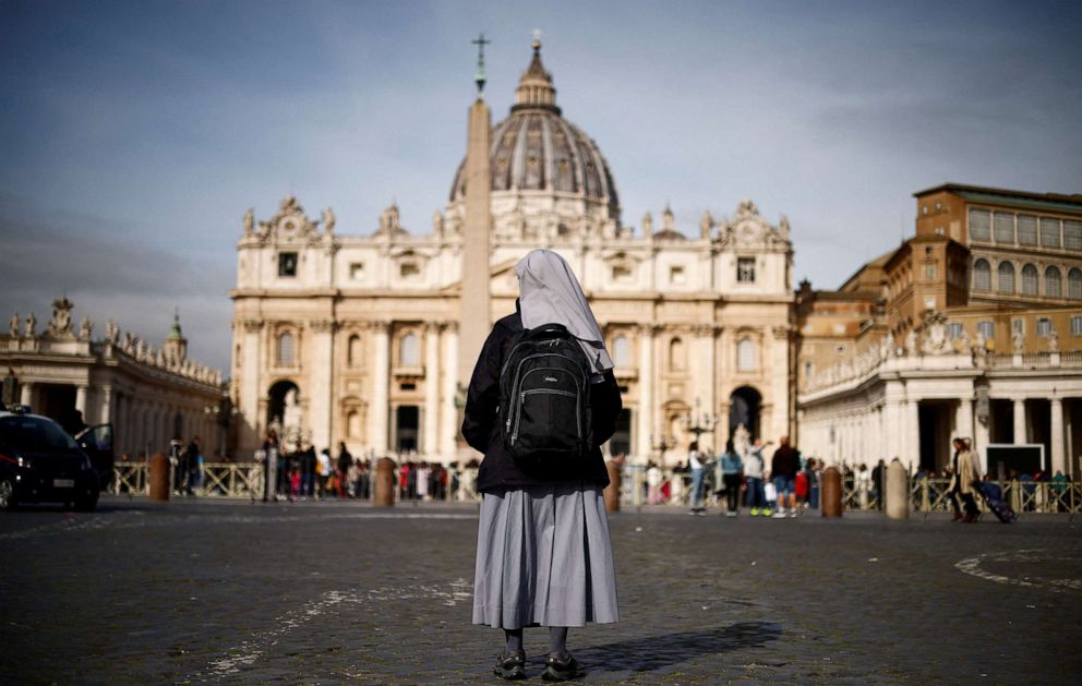 PHOTO: A nun stands in front of St. Peter's square after Pope Francis was hospitalised for a respiratory infection, at the Vatican March 30, 2023.