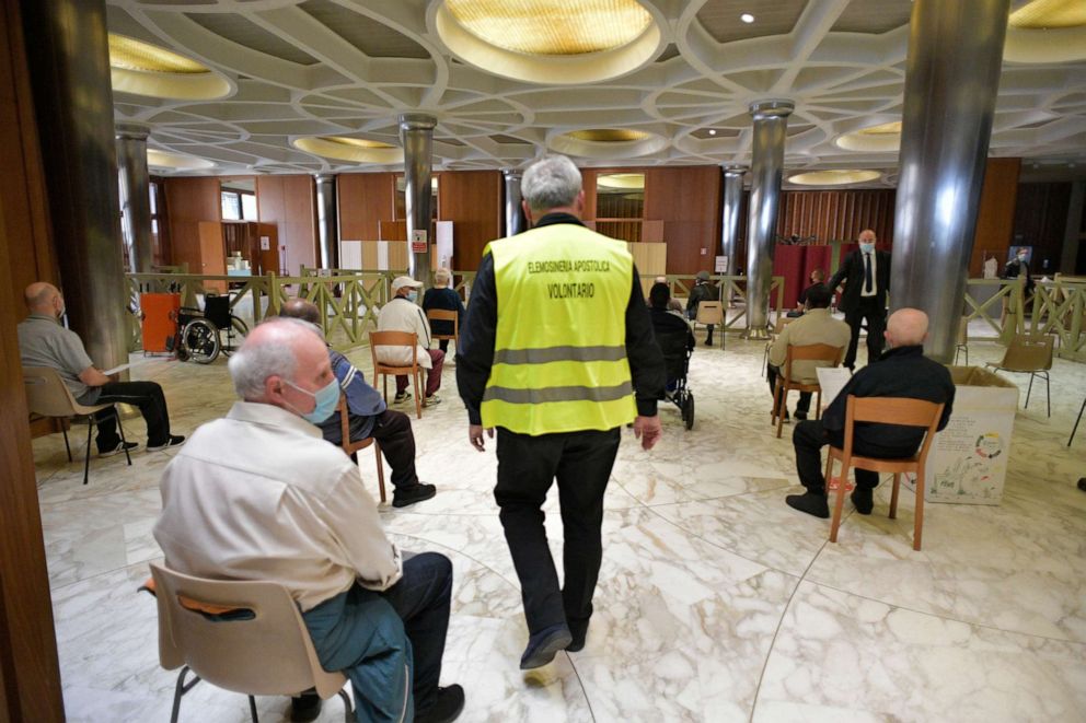 PHOTO: People wait after receiving a vaccine against the coronavirus disease (COVID-19), at Paul VI Hall in the Vatican, March 31, 2021.