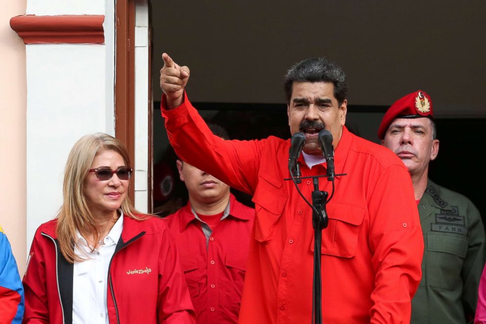 PHOTO: Venezuela's President Nicolas Maduro attends a rally in support of his government and to commemorate the 61st anniversary of the end of the dictatorship of Marcos Perez Jimenez next to his wife Cilia Flores in Caracas, Venezuela, Jan. 23, 2019.