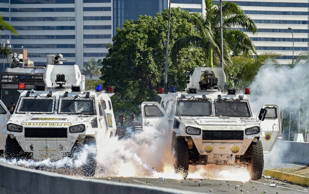 PHOTO: An explosion occurs under a military vehicle during clashes between forces loyal to Venezuelan President Nicolas Maduro and opposition demonstrators in Caracas, April 30, 2019. 