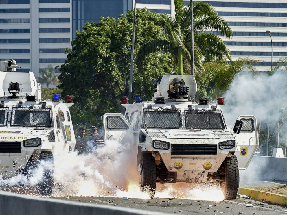 PHOTO: An explosion occurs under a military vehicle during clashes between forces loyal to Venezuelan President Nicolas Maduro and opposition demonstrators in Caracas on April 30, 2019.