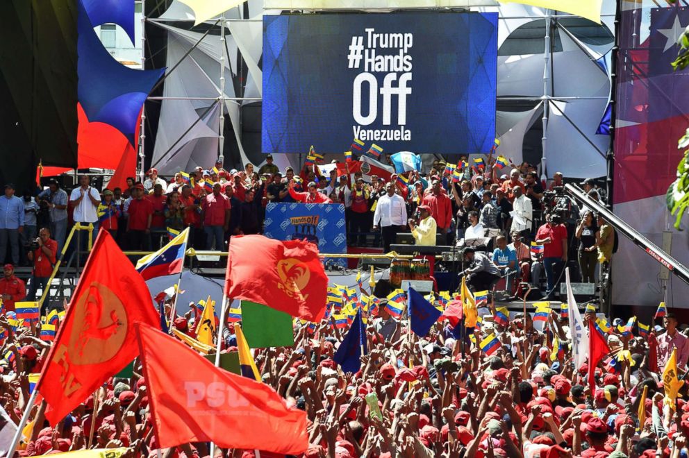 PHOTO: Venezuelan President Nicolas Maduro (C) speaks during a pro-government march in Caracas, on Feb. 23, 2019.