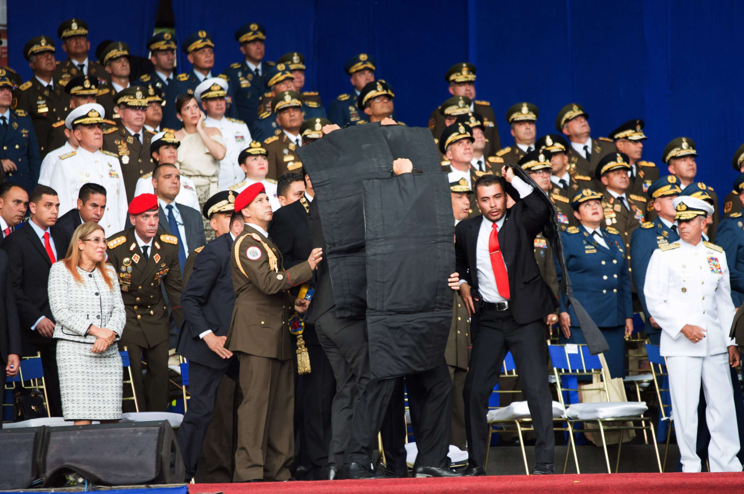 PHOTO: Security members surround and protect Venezuelan President Nicolas Maduro after his speech was interrupted in Caracas, Venezuela, on Aug. 4, 2018.