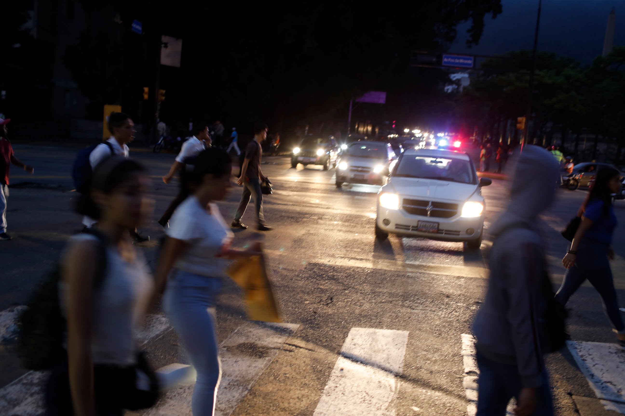 PHOTO: People cross a street during a blackout in Caracas, Venezuela, Monday, July 22, 2019.