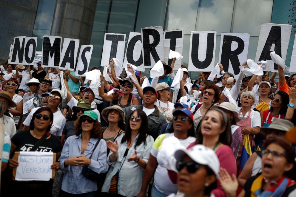 PHOTO: Opposition supporters hold signs at a rally against the government of Venezuela's President Nicolas Maduro and to commemorate the 208th anniversary of the country's independence in Caracas, Venezuela, July 5, 2019.