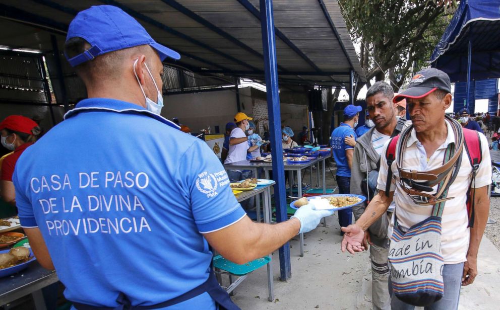 PHOTO: Venezuelan migrants are served a meal at the Divina Providencia migrant shelter in Cucuta, Colombia, on the border with Venezuela, Feb. 7, 2019.