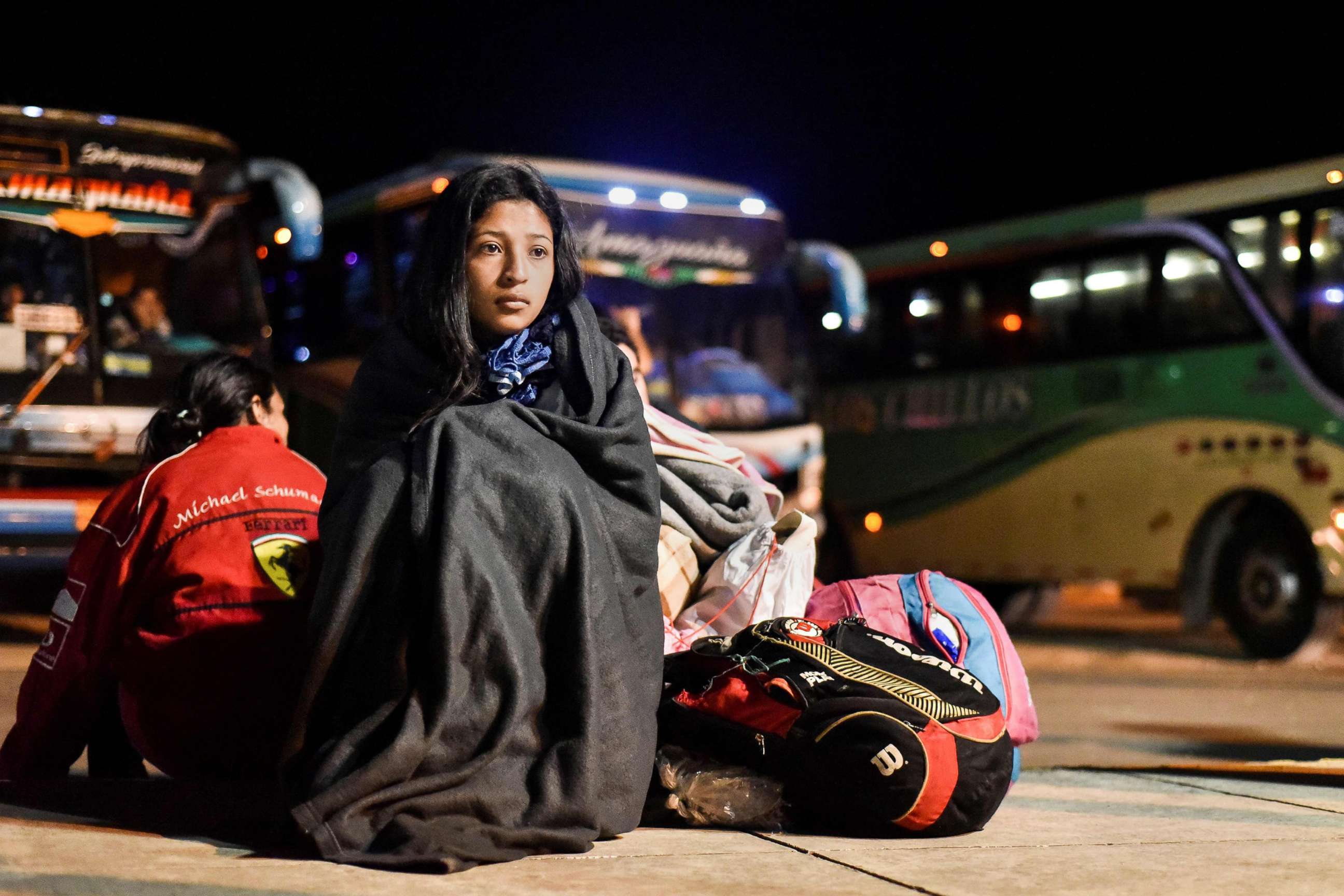 PHOTO: Nacari, 16, awaits in Huaquillas, Ecuador, along the border with Peru, after travelling across the country in a bus provided by Ecuadoran authorities for Venezuelans fleeing their country's economic crisis, Aug.25, 2018.