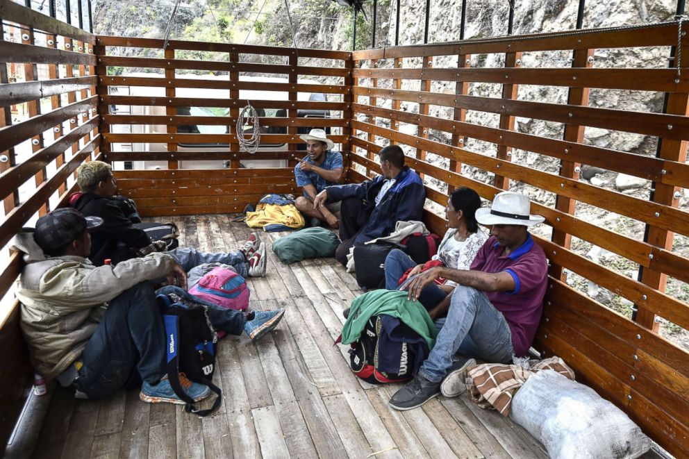 PHOTO: Members of the Mendoza Landinez family travel in the back of a truck with other Venezuelan migrants, on the Pan-American Highway in Colombia on their way to Peru, Aug. 23, 2018.
